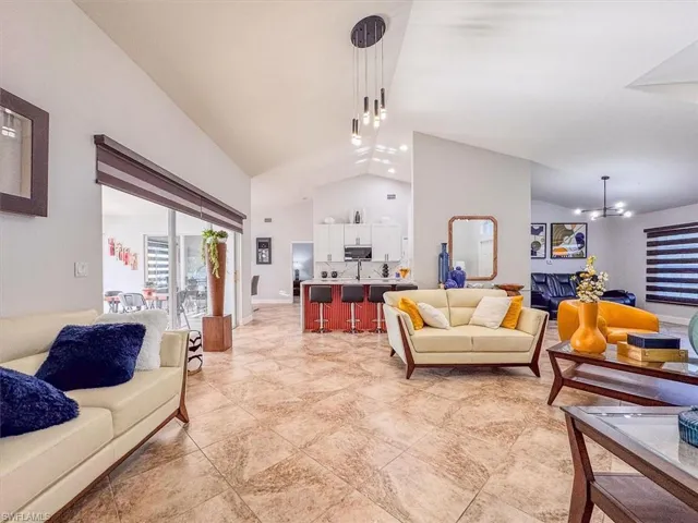Living room with high vaulted ceiling