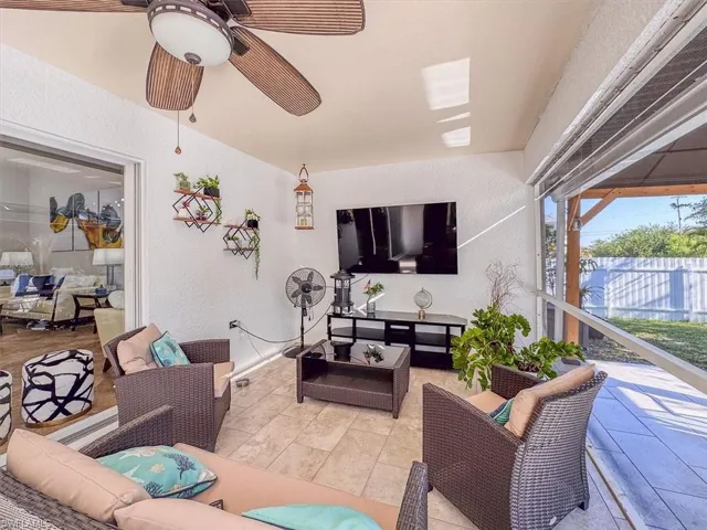 View of patio with a ceiling fan, an outdoor hangout area, and fence