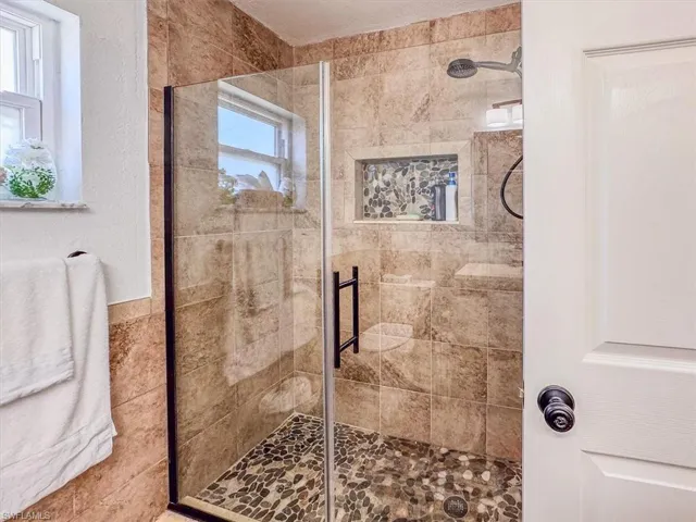 Bathroom with a tile shower