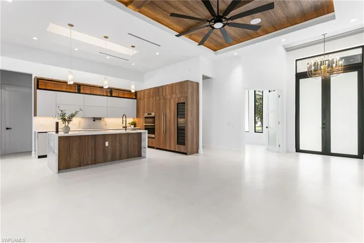 STRIKING ENTRYWAY w/ GORGEOUS GOLD CHANDELIER setting stage for EXTRAORDINARY LIVING EXPERIENCE!