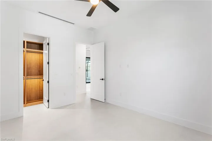 Third Guest Bedroom with custom full wall wraparound cabinetry in the closet!