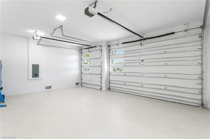 3-CAR GARAGE w/ GLASS INSERTS for lighting and INSULATED DOORS & CEILING for HOME ENERGY EFFICIENCY.
