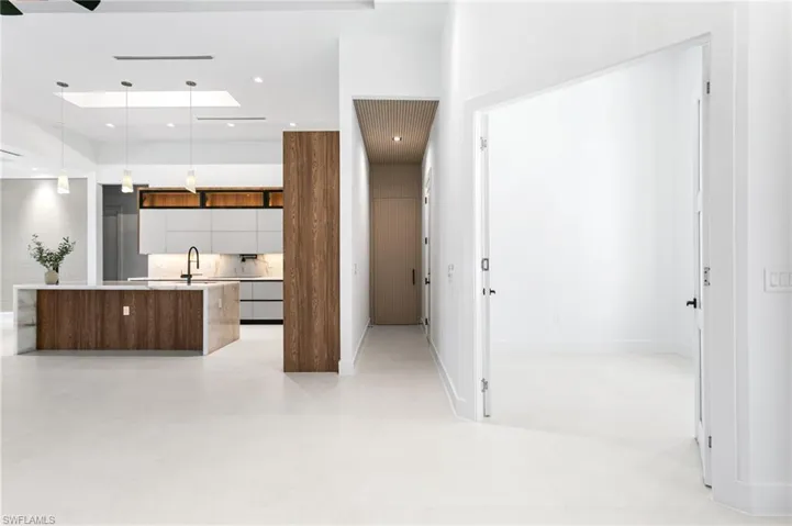 French Double Glass Doors to the DEN & Acoustic paneling to the LAUNDRY