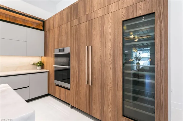 DACOR MODERNIST electric WALL OVEN w/ built-in WALL MICROWAVE, INDUCTION COOKTOP w/ black glass & GUIDED COOKING, INTEGRATED DISHWASHER & custom BUILT-IN SIDE-BY-SIDE REFRIGERATOR/FREEZER.