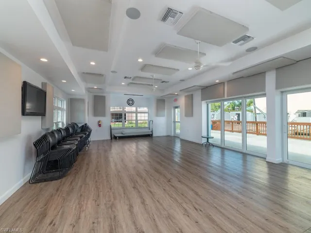 Living room featuring hardwood / wood-style flooring and ceiling fan