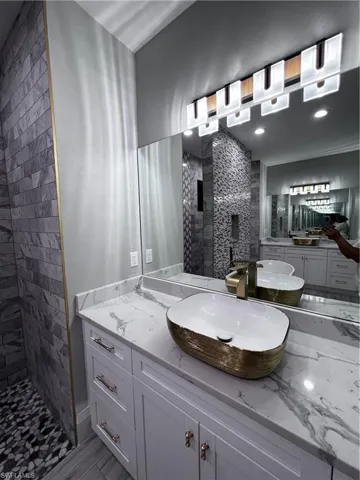 Bathroom with a stall shower and two vanities