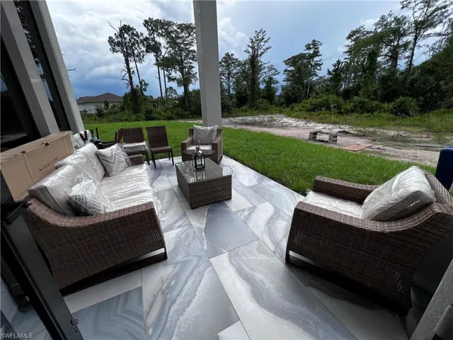 View of patio featuring an outdoor hangout area