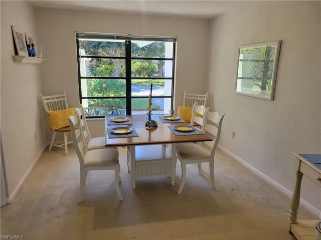 Dining area with carpet flooring