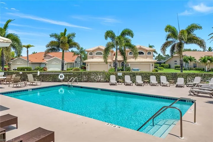 Community pool with a residential view and a patio