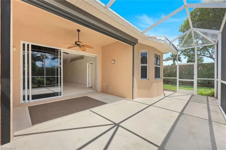 View of patio / terrace with a ceiling fan and glass enclosure