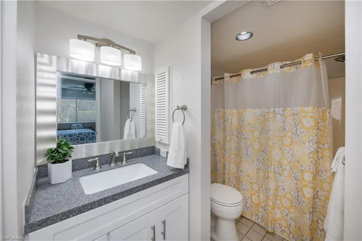 Updated bright and cheerful ensuite bath with tiled floor