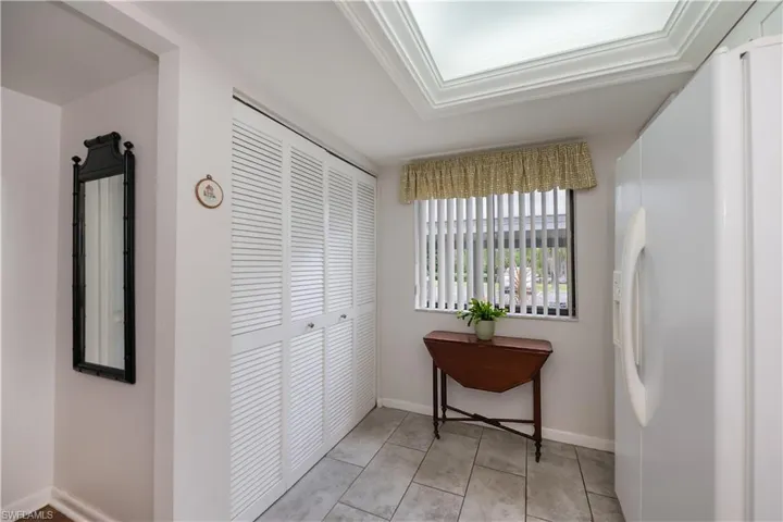 Much appreciated window, large neutral tile and enclosed laundry just steps away
