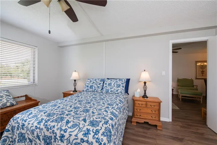 Neutral colors with beautiful flooring and  room for all your bedroom furniture