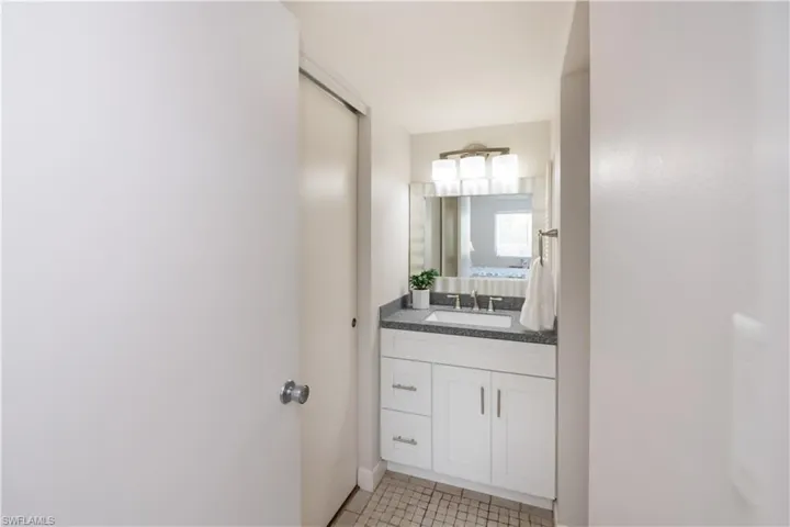 Enjoy your new vanity with solid surface top, under mount sink new mirror and light fixture as well as additional closet