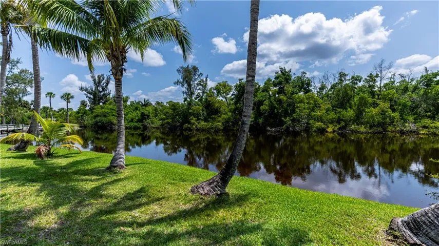 Serene surroundings with view of pond private to the community