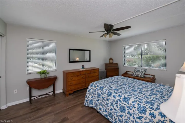 Welcome to your spacious Primary Suite with inviting outdoor views of the pool and landscaping