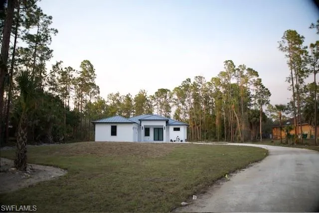 View of front of home featuring a front yard
