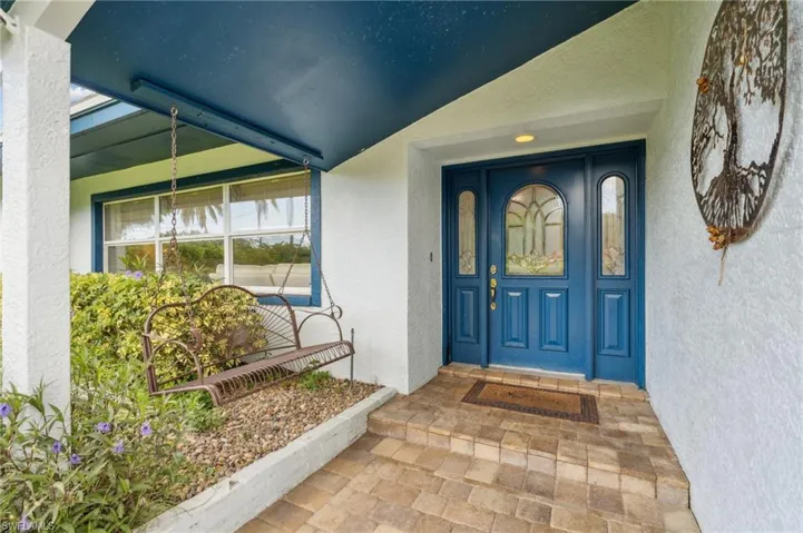 Property entrance featuring covered porch
