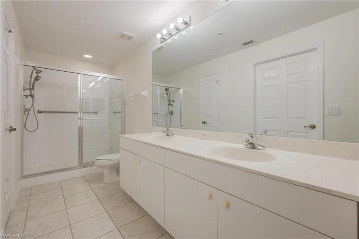Main bath with storage closet & walk in closet