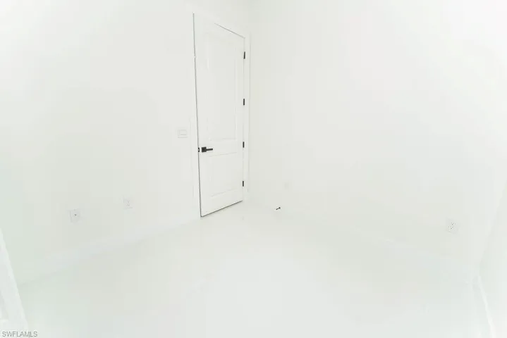 Empty room with light tile patterned floors