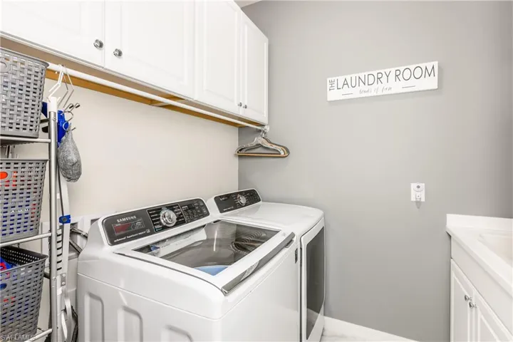 Laundry Room with a slop sink and built in cabinets