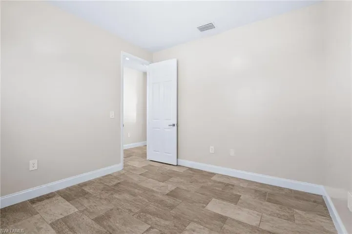 Spare room with baseboards