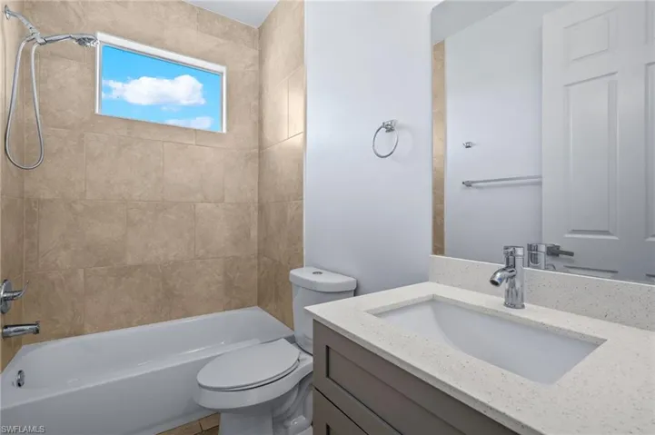 Bathroom featuring vanity and bathtub / shower combination