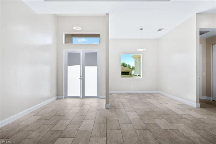 Foyer entrance featuring baseboards