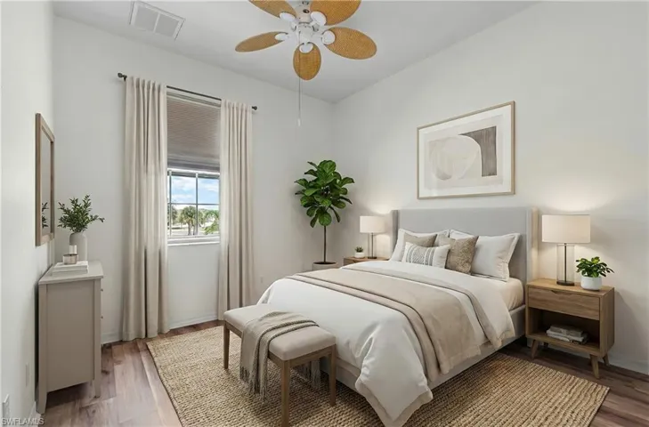 Bedroom with wood finished floors and ceiling fan