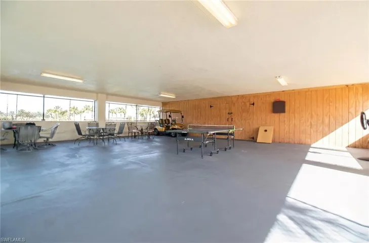 View of patio / terrace featuring outdoor dining area and a sunroom