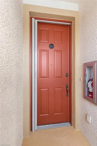 View of exterior entry featuring stucco siding