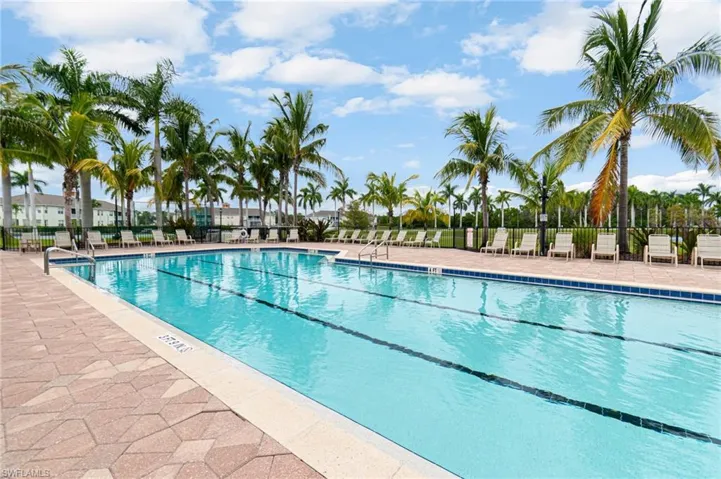 Community pool with a patio area