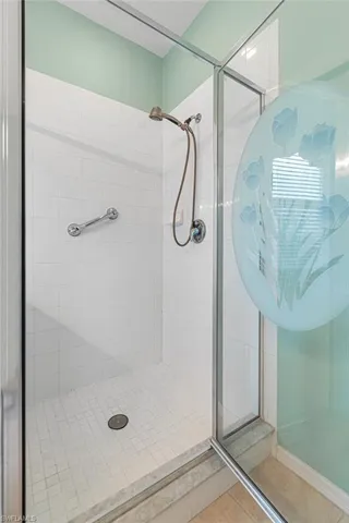 Bathroom featuring a stall shower and tile patterned floors