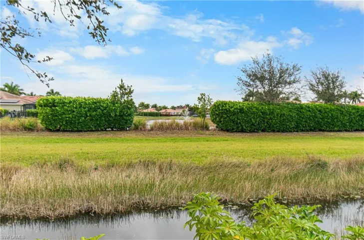 View of yard with a water view