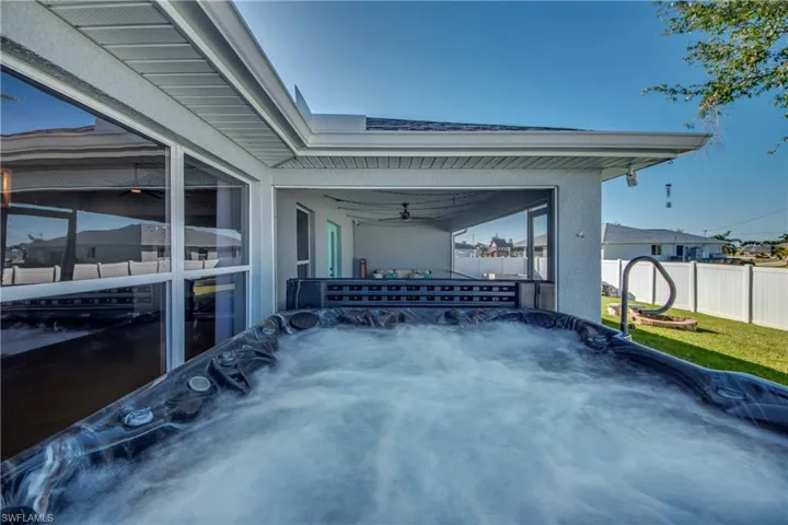 View of patio featuring a hot tub