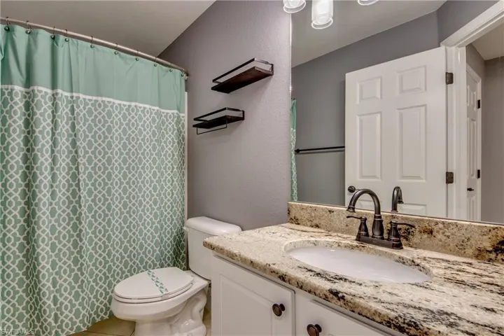 Bathroom with vanity and toilet