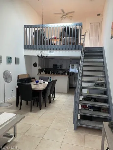 Tiled dining area with ceiling fan