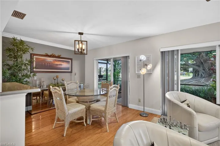 Dining space featuring hardwood / wood-style flooring and a chandelier