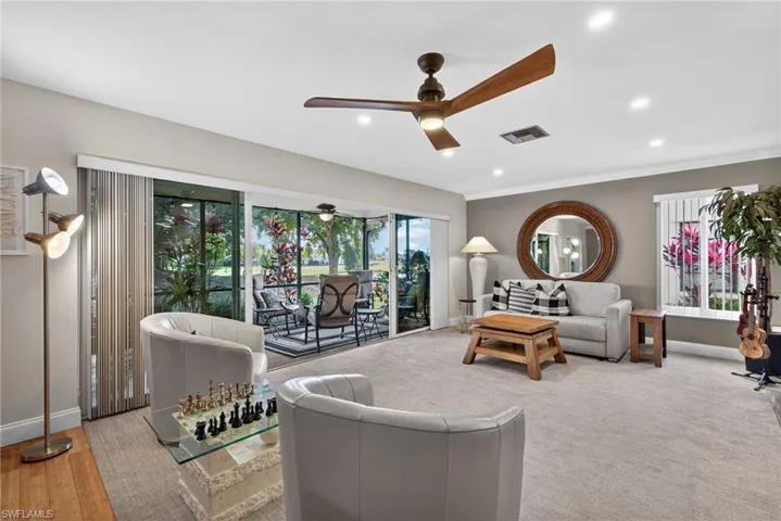 Living area with ceiling fan and recessed lighting
