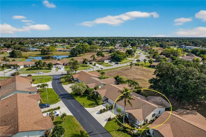 Aerial perspective of suburban area with a large body of water