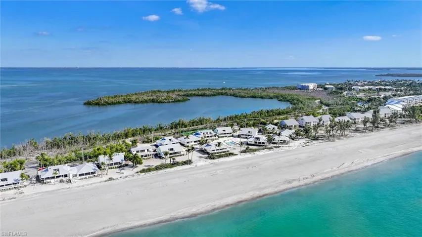 Aerial view of residential area with expansive coastline