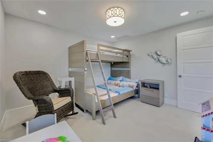 Bedroom featuring light wood-type flooring and recessed lighting