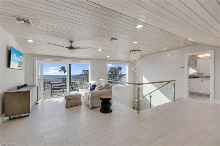 Living area featuring wooden ceiling, a ceiling fan, recessed lighting, and light wood-type flooring