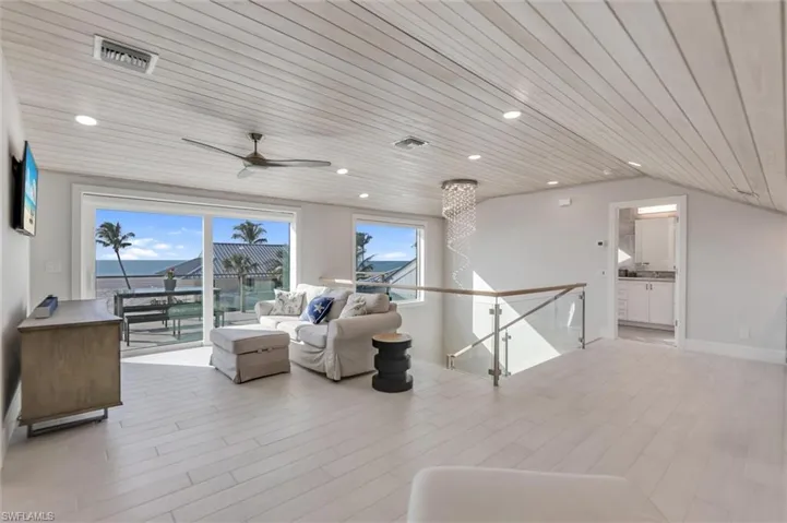 Living area featuring wooden ceiling, light wood finished floors, ceiling fan, and recessed lighting