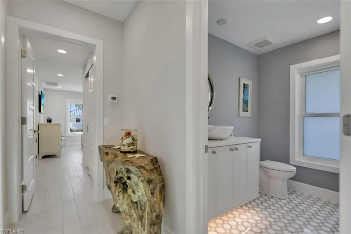 Half bath featuring recessed lighting and vanity