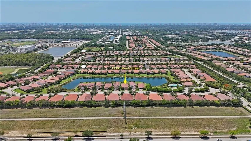 View of residential area featuring a large lake and nearby residential area