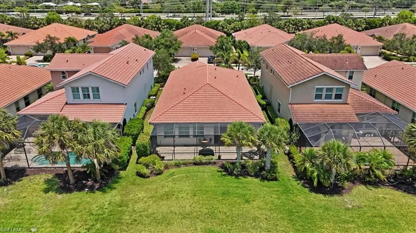 Aerial perspective of residential area featuring screened patio