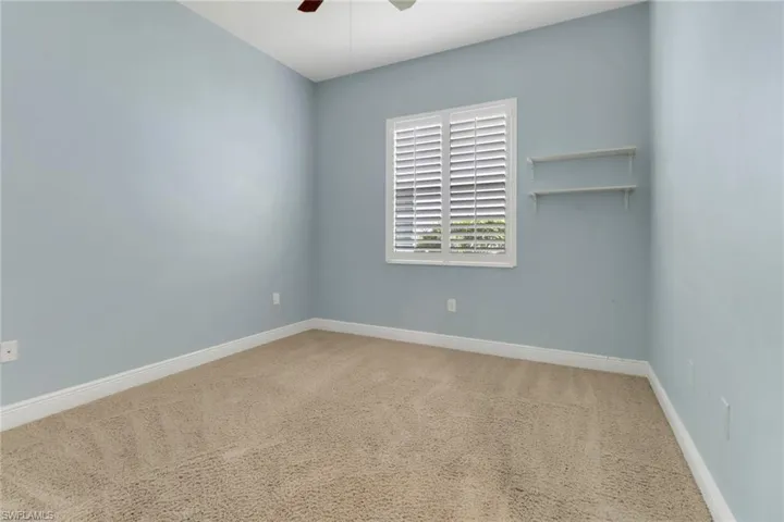 Bedroom with carpet flooring and a ceiling fan