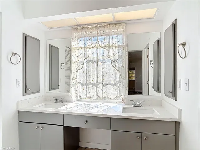 Bathroom featuring double vanity