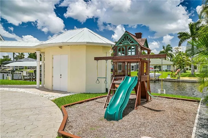 View of play area featuring a water view